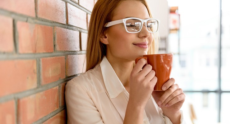 image of woman drinking from a mug